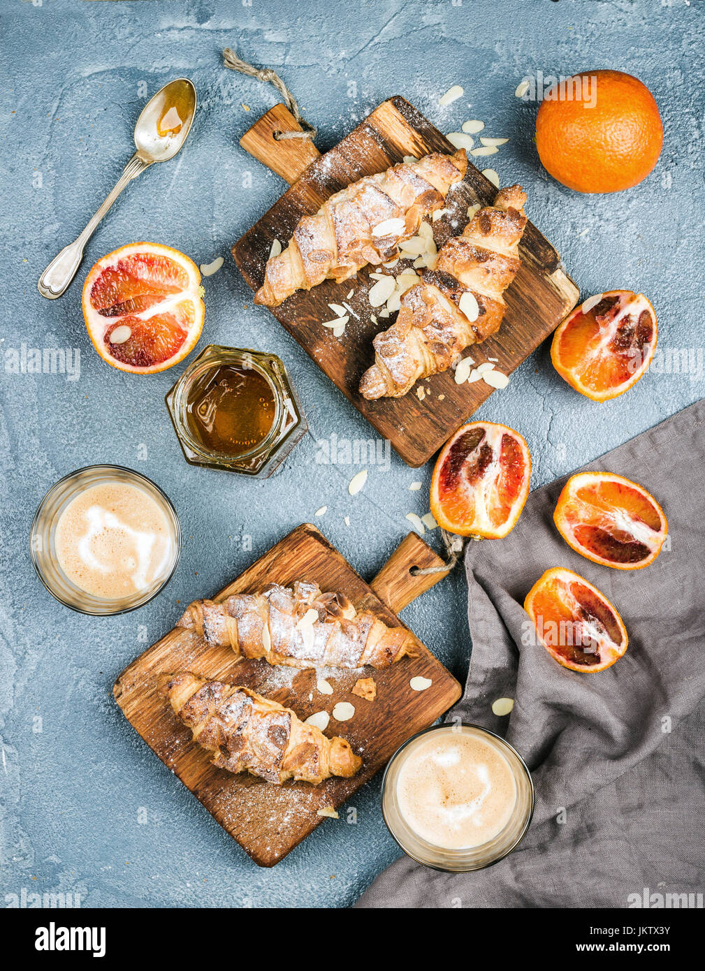 Traditional Italian style home breakfast. Latte in glasses, almond