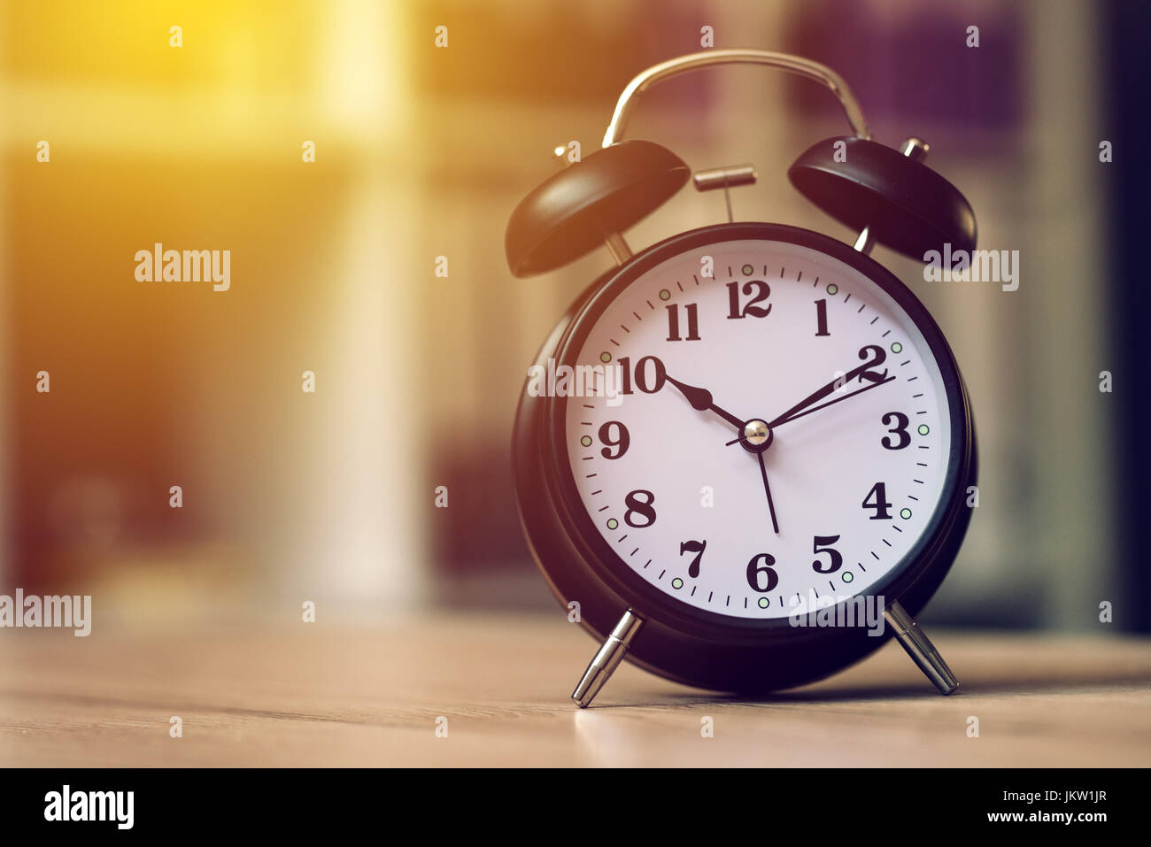 Classic alarm clock showing time during working hours or work break in