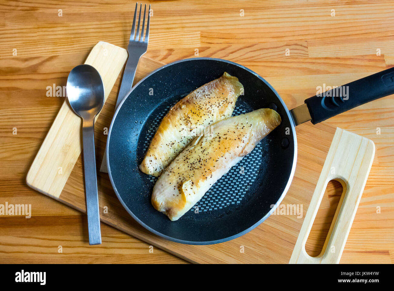 Grilled tilapia ready to serve from a nonstick pan Stock Photo Alamy