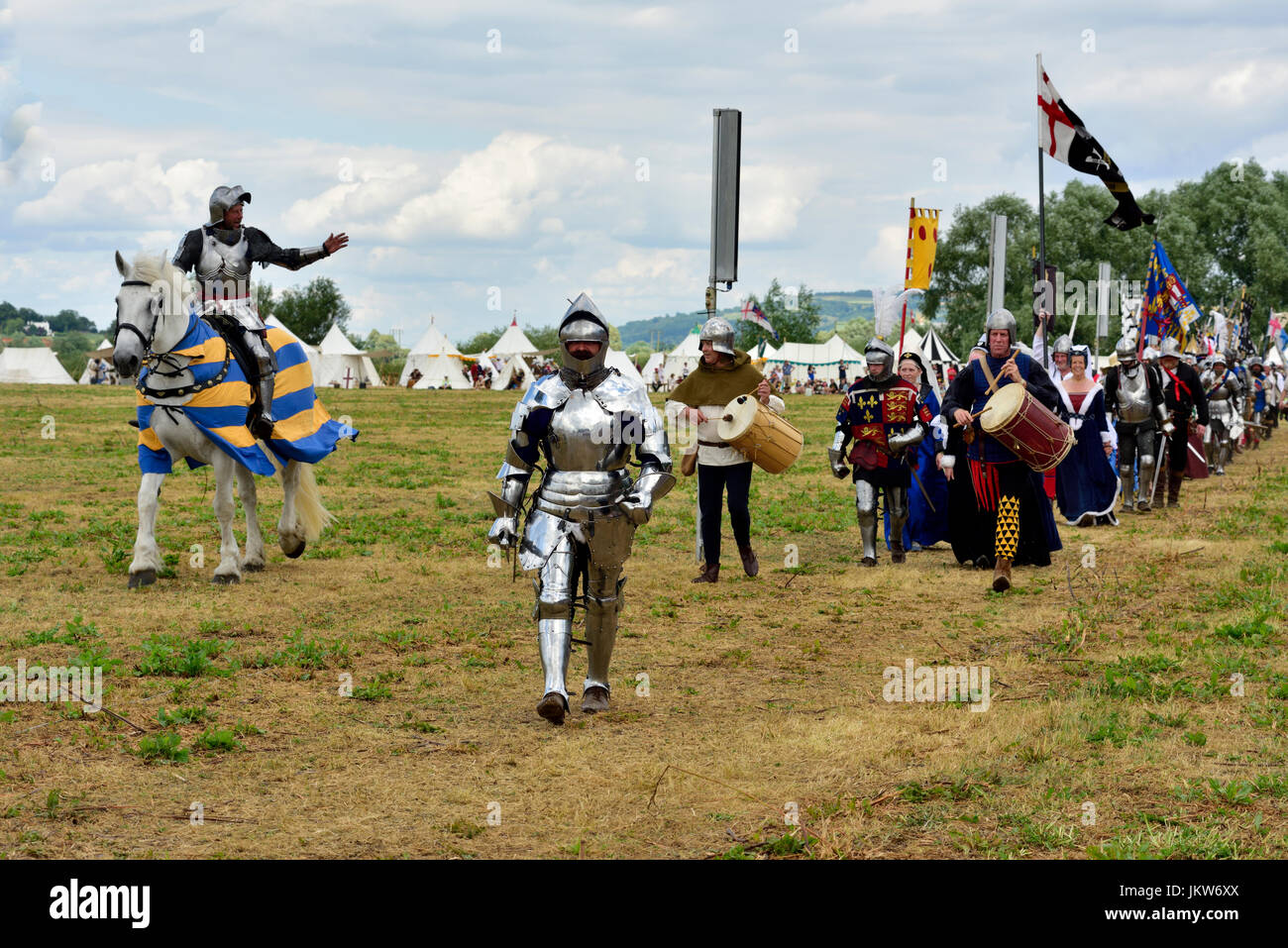 Re-enactor knights in armour marching, one on horseback, Tewkesbury Medieval Festival, 2017 Stock Photo