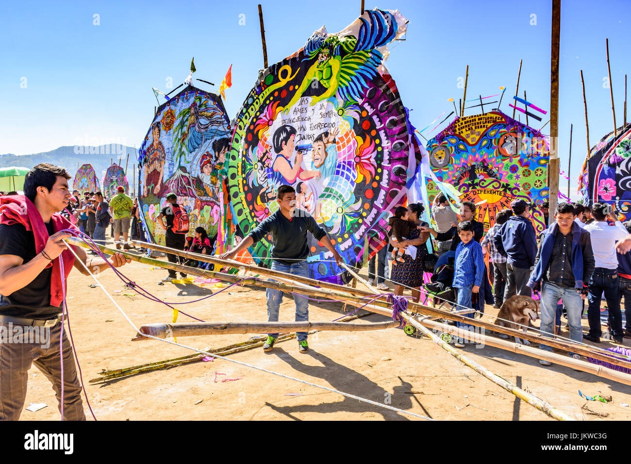 Sumpango, Guatemala - November 1, 2015: Men with bamboo framework of handmade kite at giant kite festival on All Saints' Day honoring spirits of dead. Stock Photo