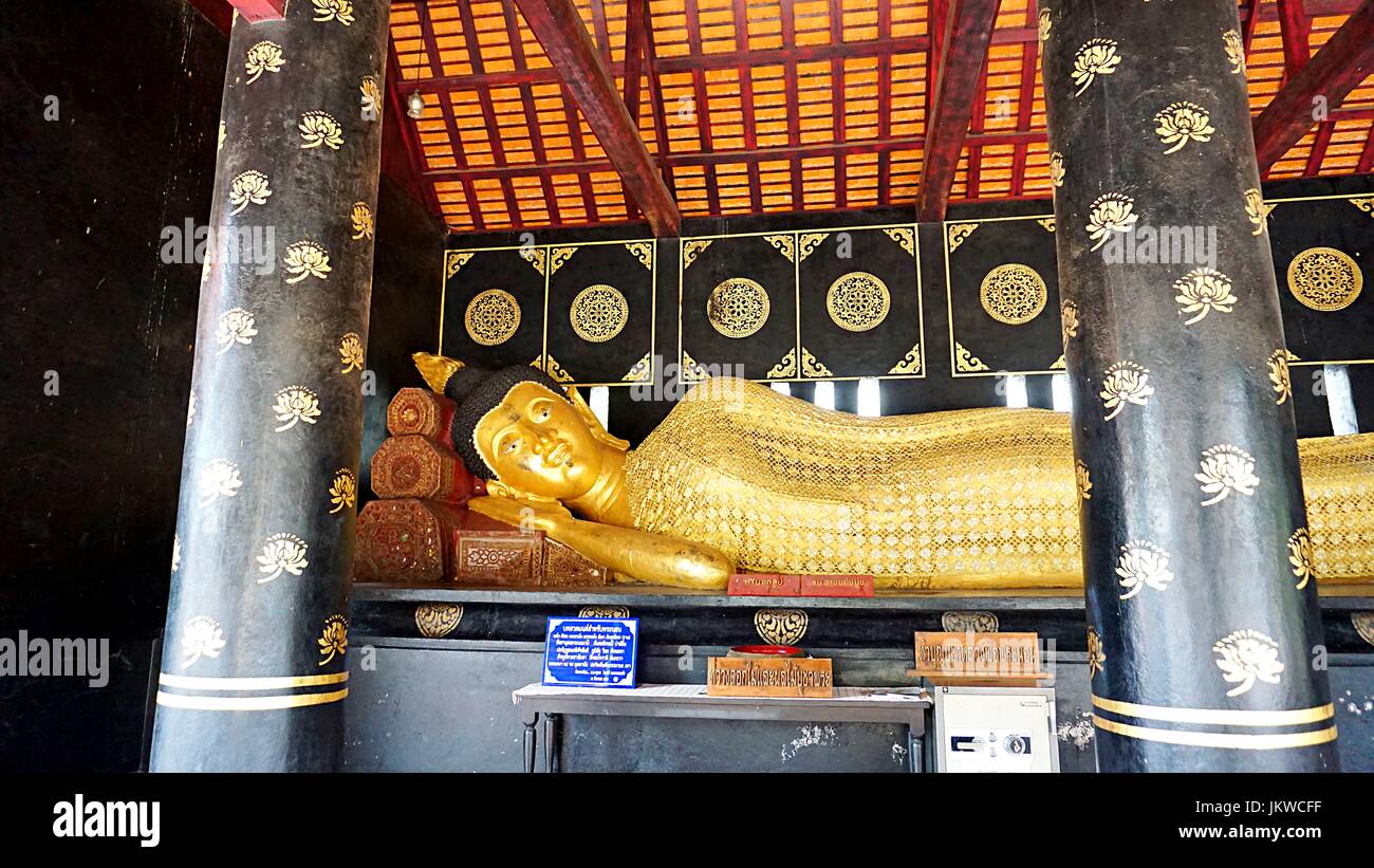 Golden reclining Buddha image statue in Thai temple in Chiang Mai, Thailand. Stock Photo