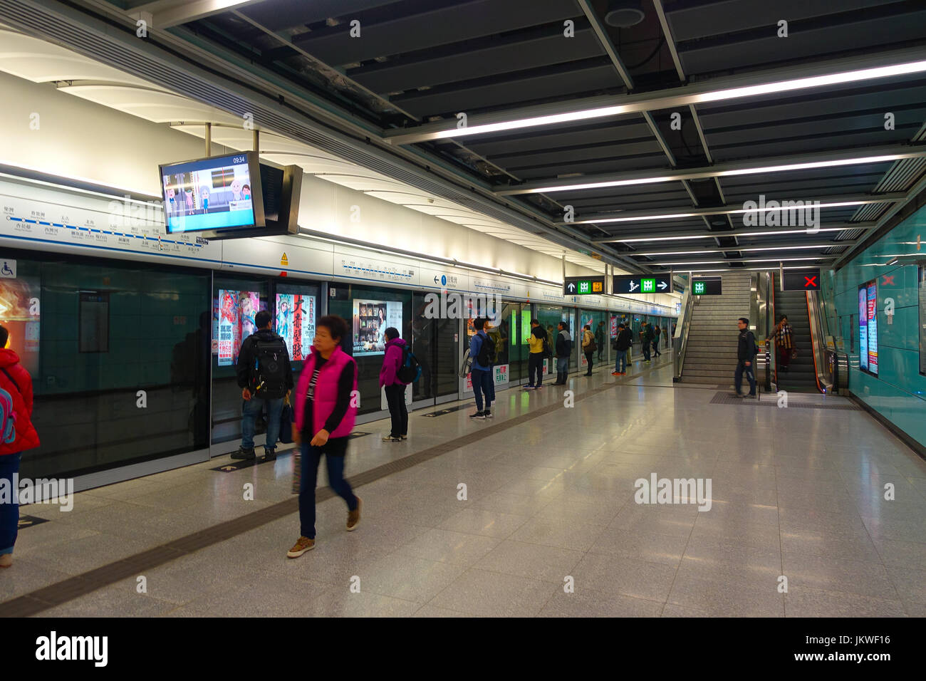 HONG KONG, CHINA - JANUARY 26, 2017: Unidentified people in the subway train station in Hong Kong. MTR is the most popular transport in Hong Kong. Stock Photo