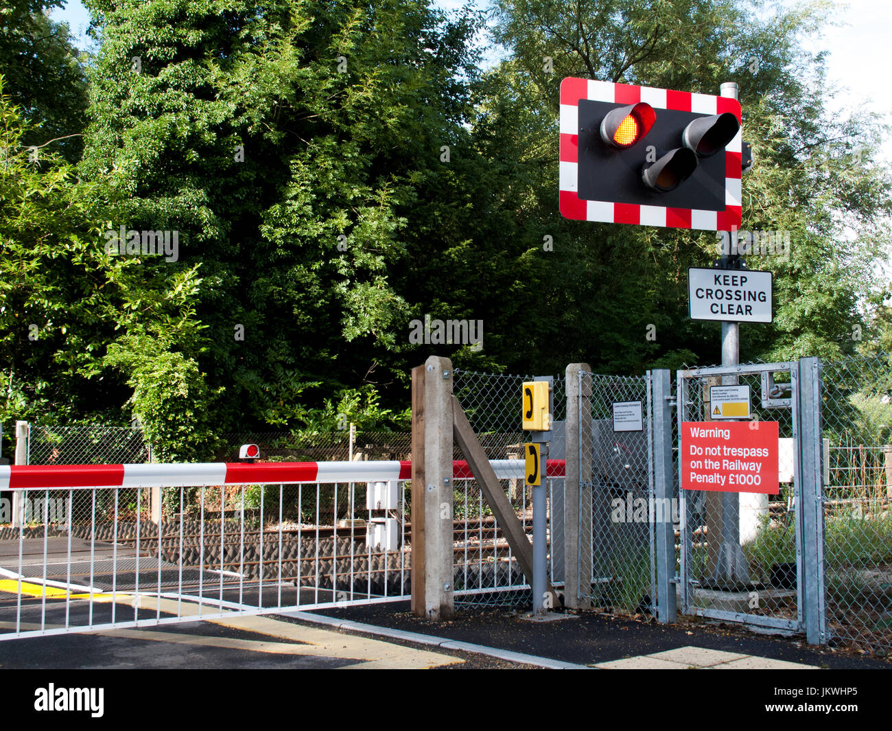 Rural Railway Level Crossing With Barriers Down Across Roadway For Approaching Train With Warning Signs And Lights Stock Photo Alamy Rural Railway Level Crossing With Barriers Down Across Roadway For Approaching Train With Warning Signs And Lights Stock Photo Alamy