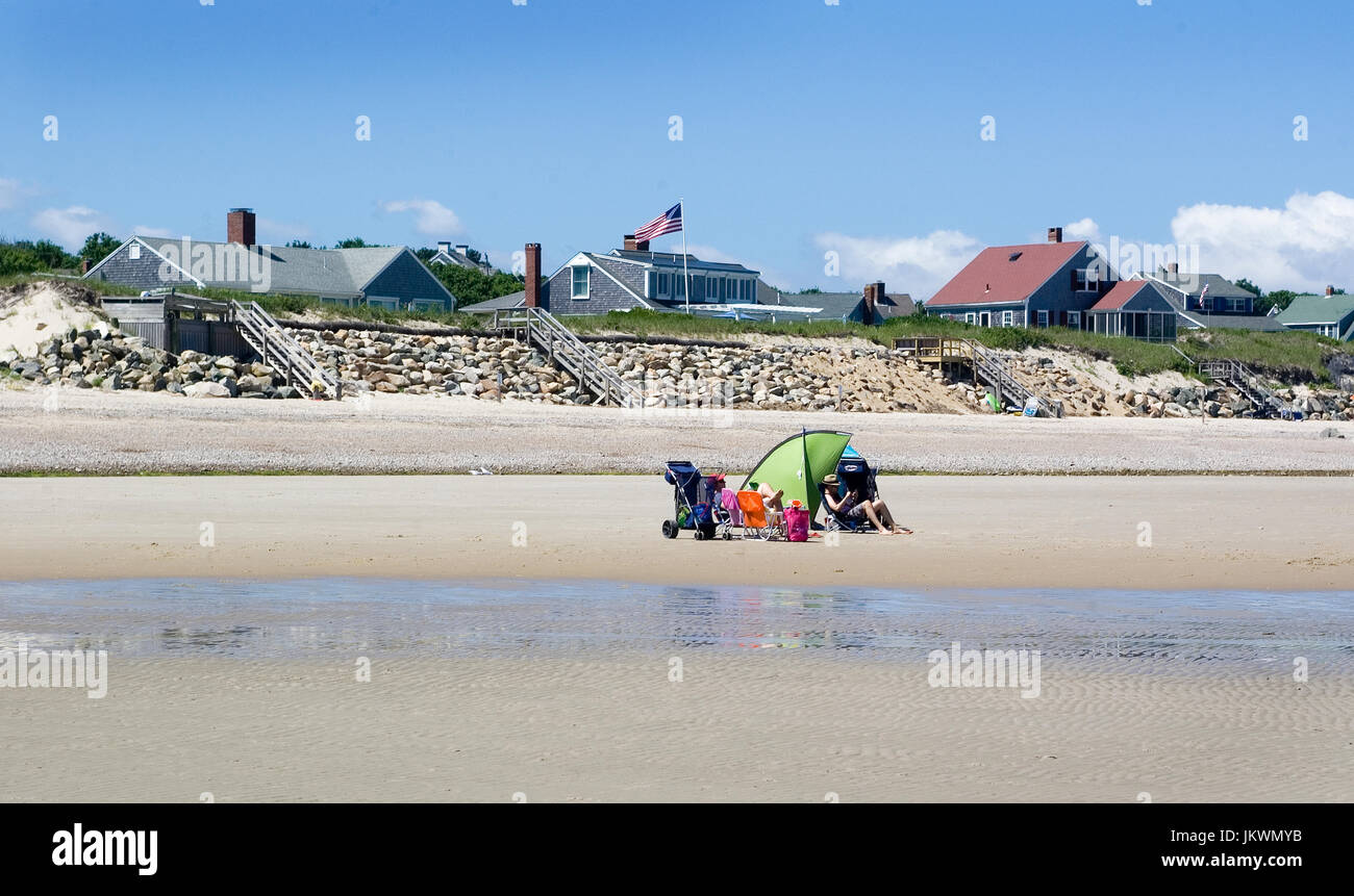 Vacationers relaxing on a private Cape Cod beach. Stock Photo