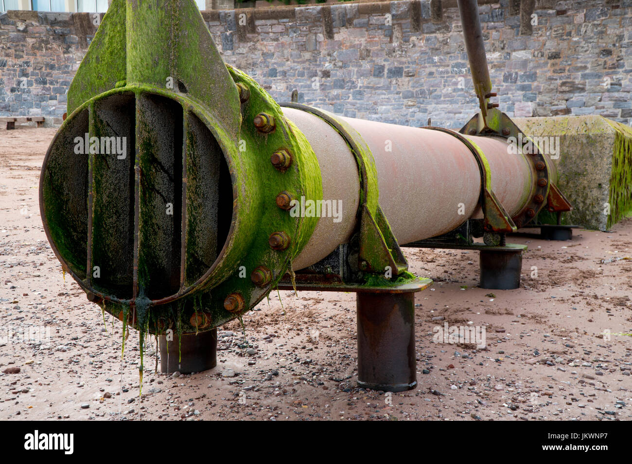 Outflow storm drain pipe on Teignmouth beach, England, UK Stock Photo