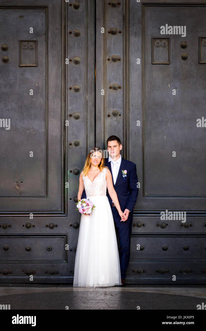 Bride and groom posing on the old streets of Rome, Italy Stock Photo ...