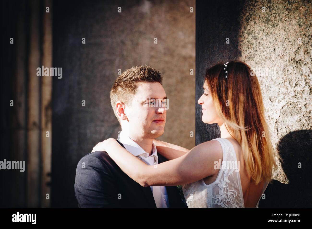 Bride and groom posing on the old streets of Rome, Italy Stock Photo ...