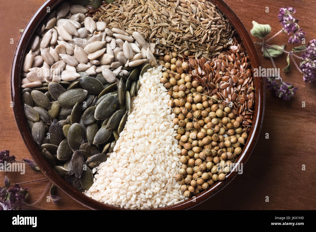 Spices and herbs in ceramic bowl. seasoning. Colorful natural additives. Stock Photo