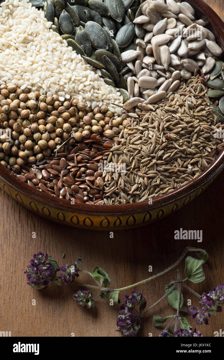 Spices and herbs in ceramic bowl. seasoning. Colorful natural additives. Stock Photo
