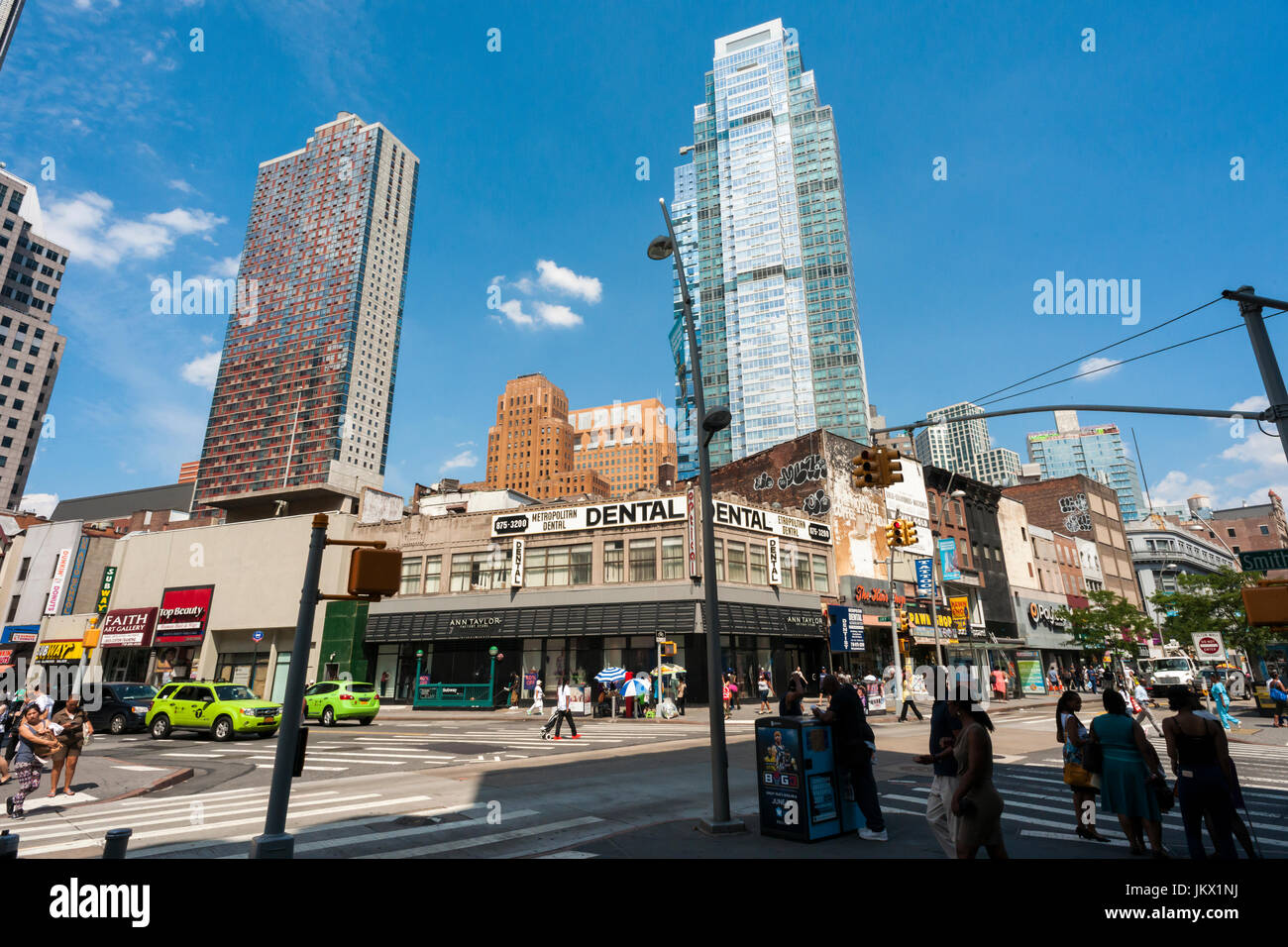 Residential development rises above Downtown Brooklyn in New York on Wednesday, July 19, 2017. The area has been for years a middle and lower economic shopping strip but because of increased development in the area, notably hi-rise luxury apartment buildings, chain stores and high-end retailers are moving in. Rents are rising and the smaller mom and pop stores, as well as regional chains are being forced out.  (© Richard B. Levine) Stock Photo