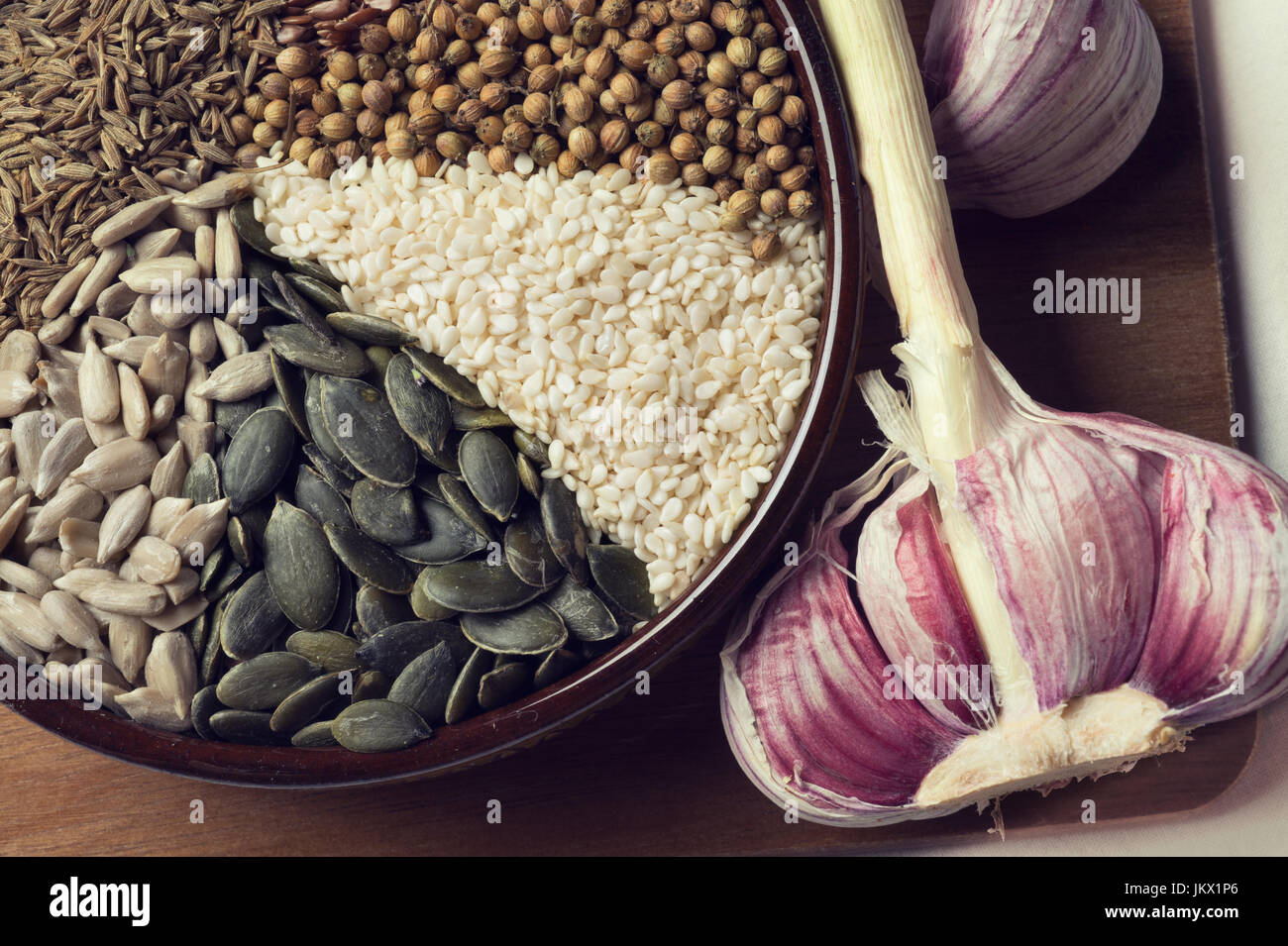 Spices and seeds in ceramic bowl. seasoning. Colorful natural additives. Stock Photo