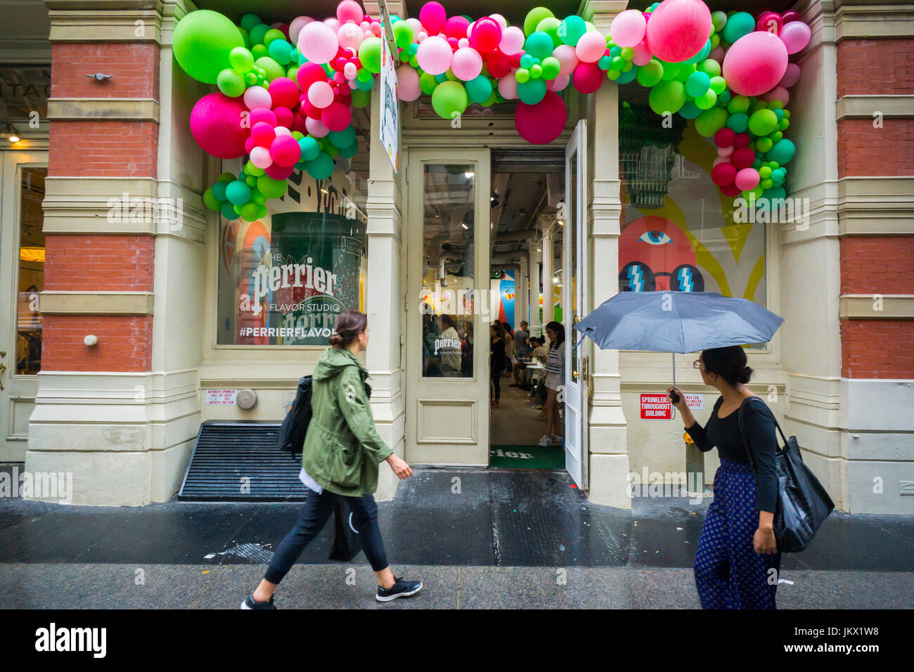 Colorful balloons decorate the front of a Perrier Flavor Studio pop-up promoting new flavors of their carbonated waters, seen in Soho in New York on Friday, July 14, 2017 (© Richard B. Levine) Stock Photo