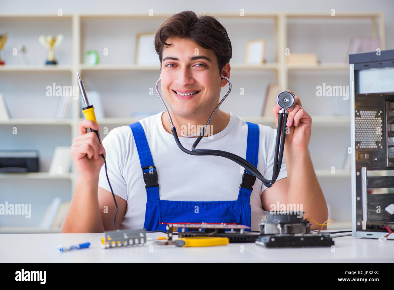 Computer Rebort Man Computer repairman repairing desktop computer Stock Photo - Alamy