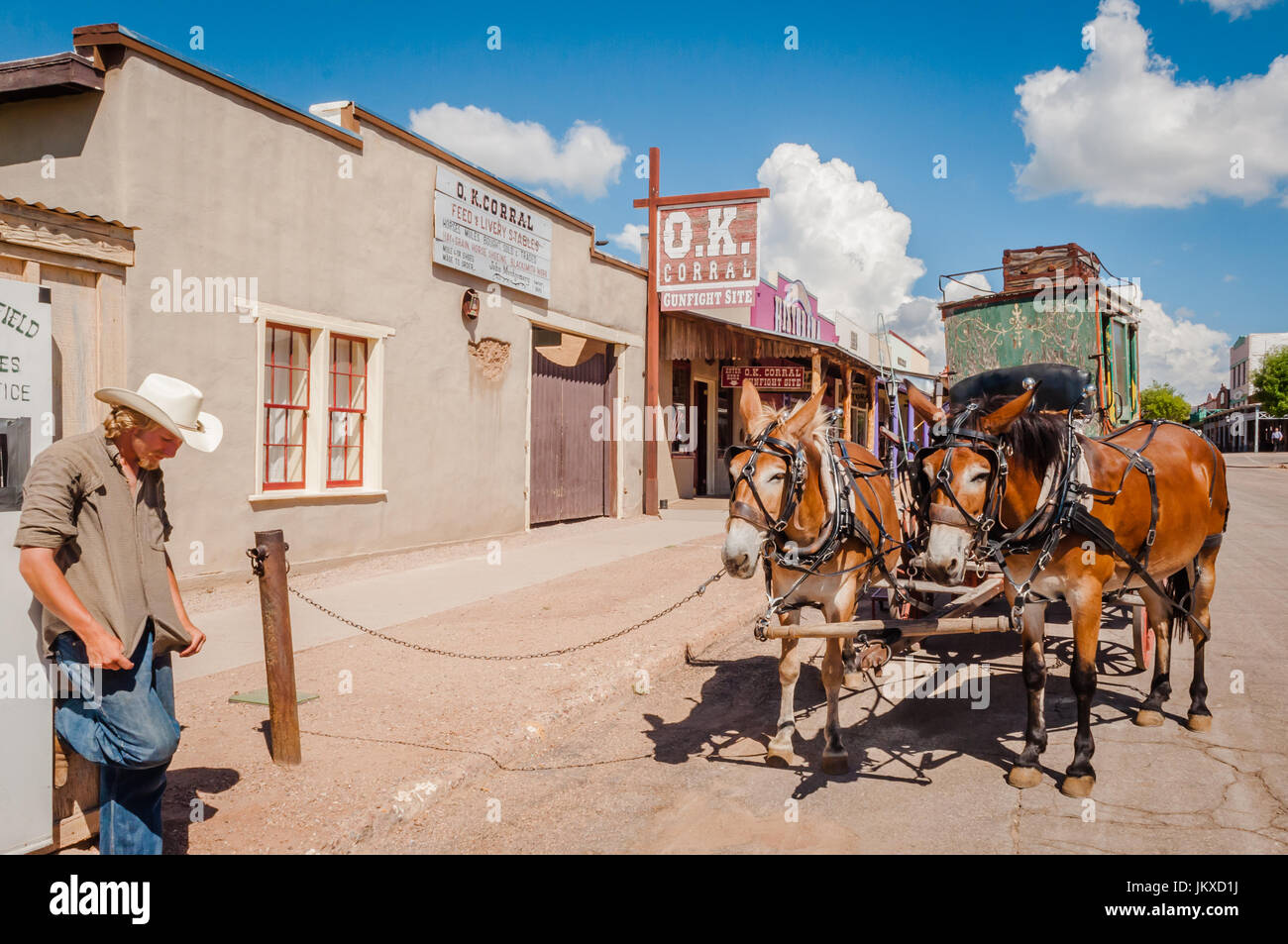 Mule-drawn stagecoach driver stands waiting for customers in Tombstone Arizona Stock Photo