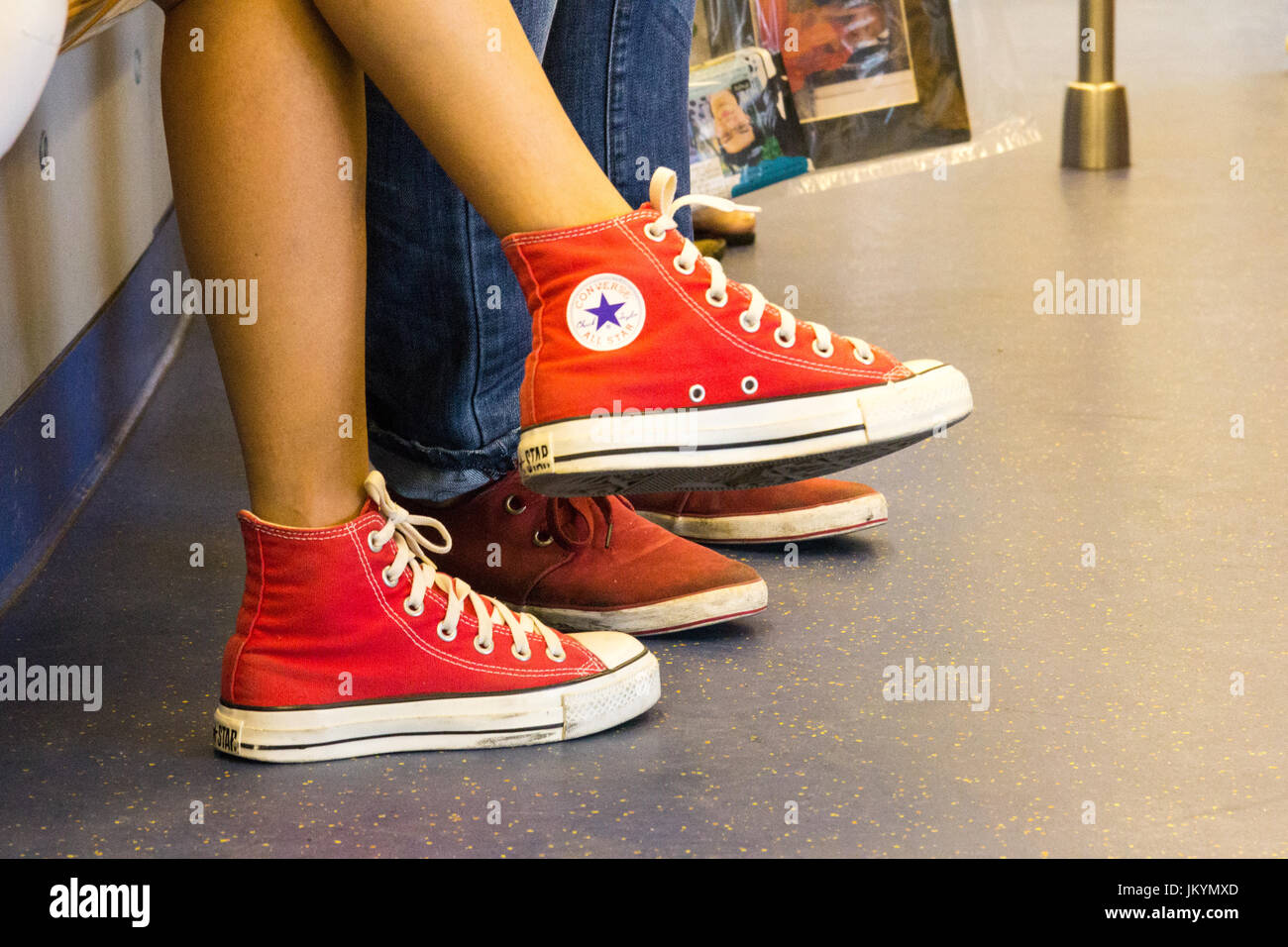 Young girl wearing pair of Converse All Star shoes Stock Photo - Alamy