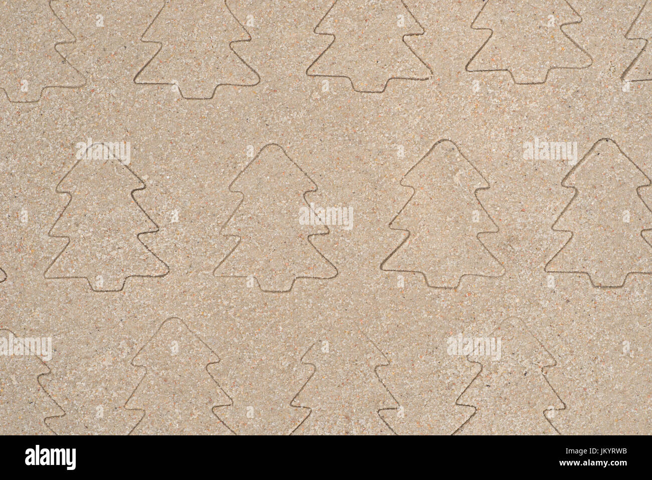 Christmas trees patterndrawing in sand background Stock Photo - Alamy
