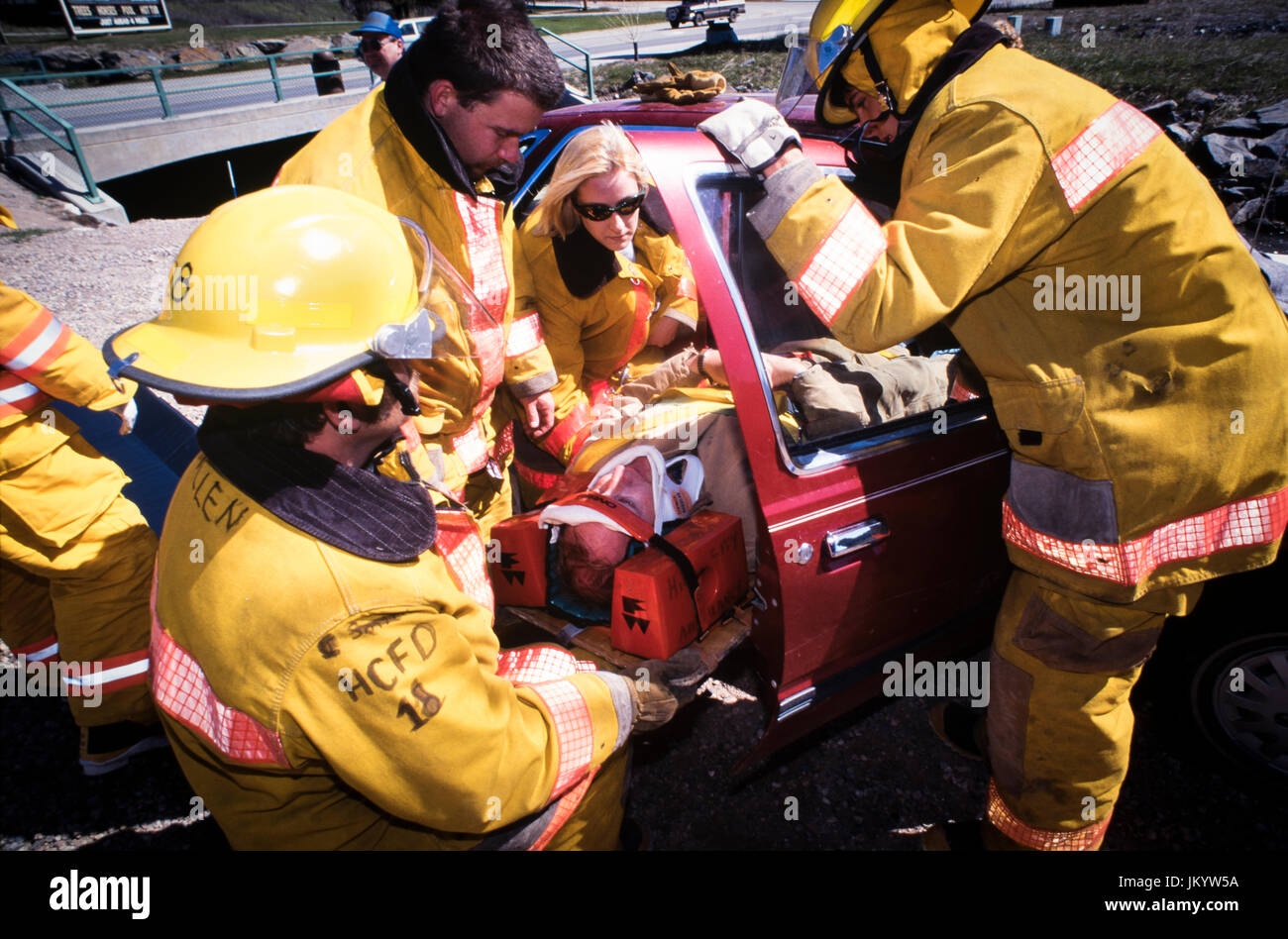 South Dakota firefighters take part in victim extrication training during a motor vehicle crash scenario using hydraulic prying and cutting tools. Stock Photo