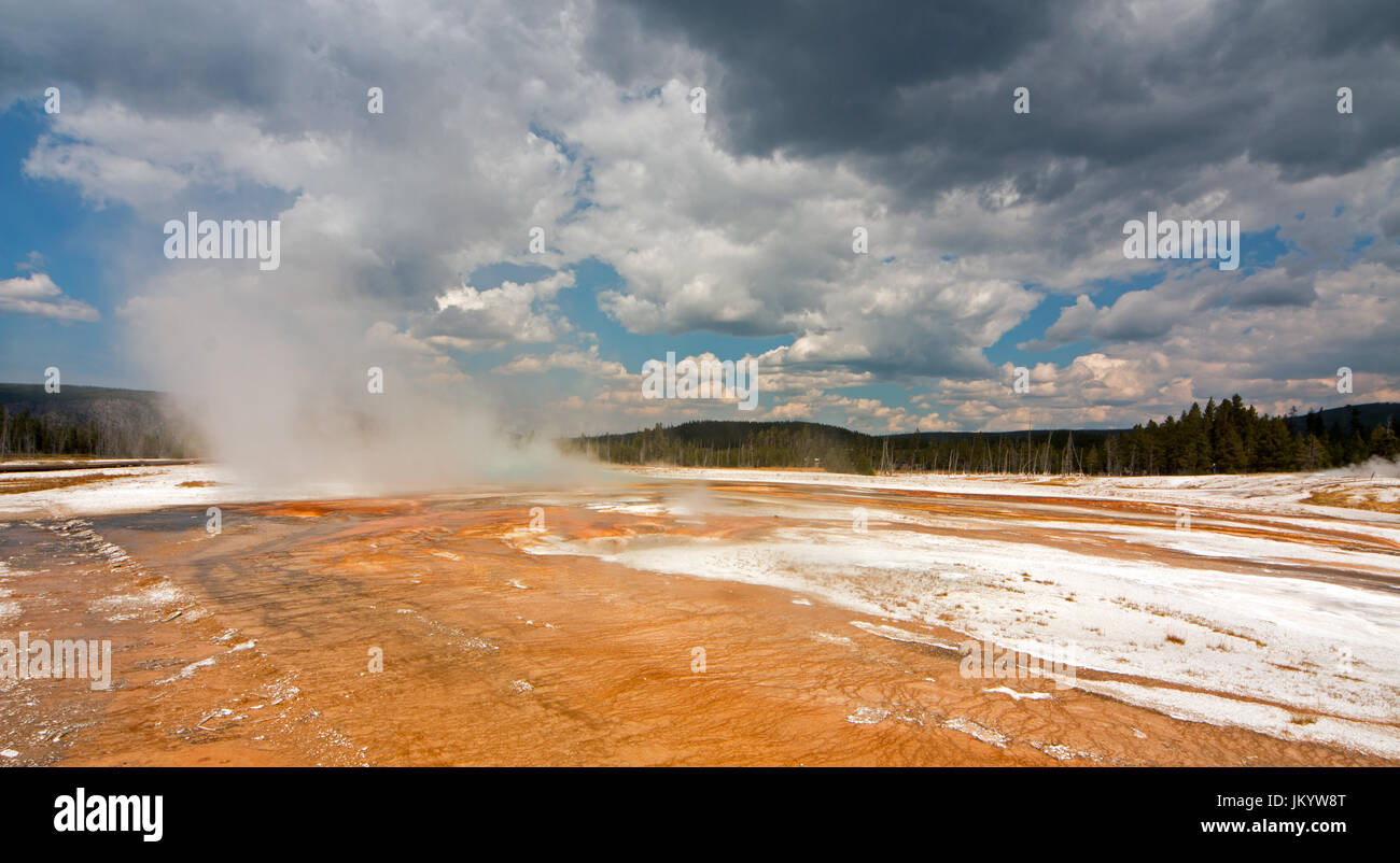 Rainbow Pool hot spring run off past the Cliff Geyser into Iron Spring Creek in Black Sand Basin in Yellowstone National Park in Wyoming United States Stock Photo