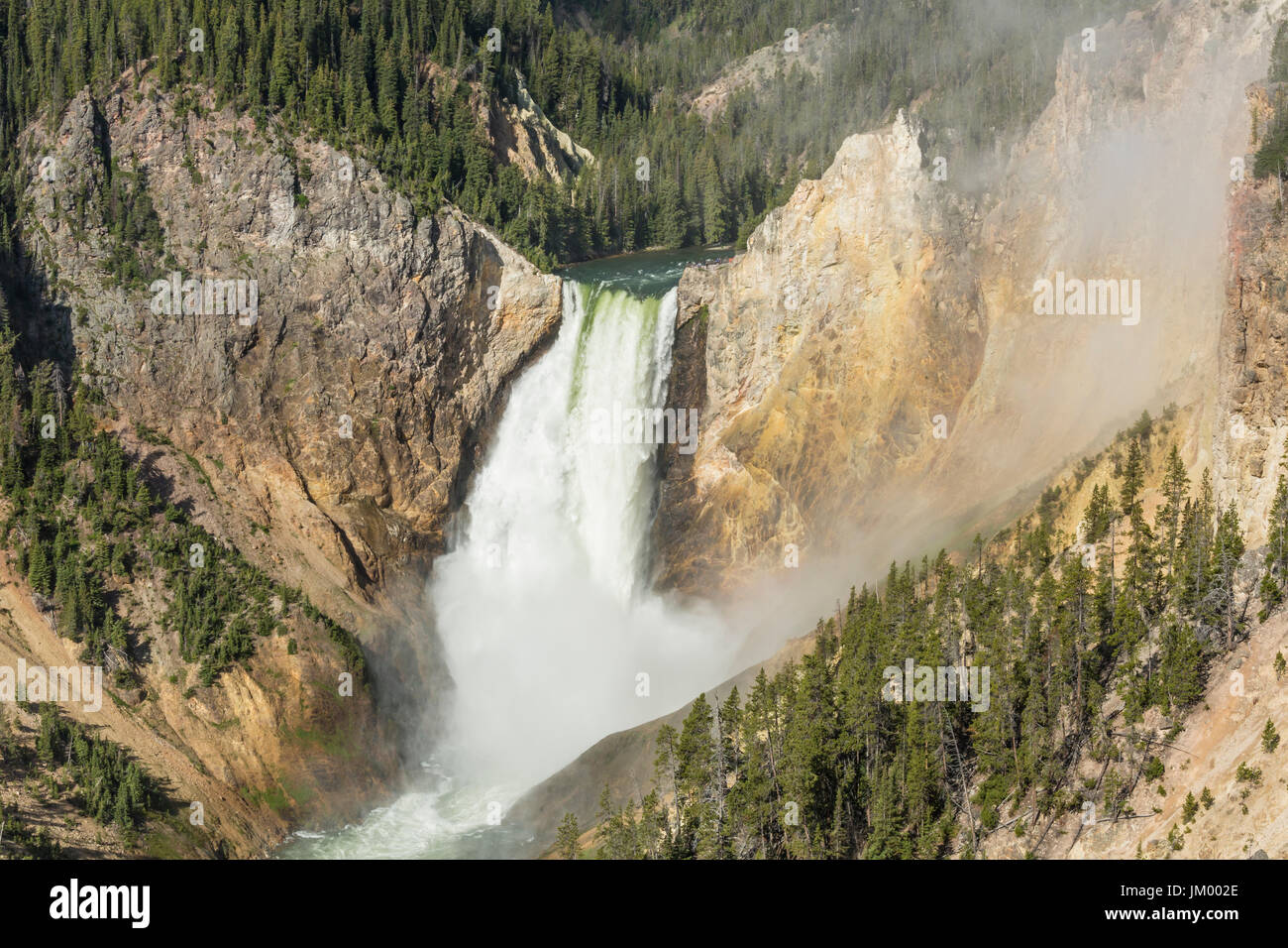 Mist enshrouds the 300 foot Lower Falls in the Grand Canyon of the Yellowstone in Yellowstone National Park, Wyoming Stock Photo