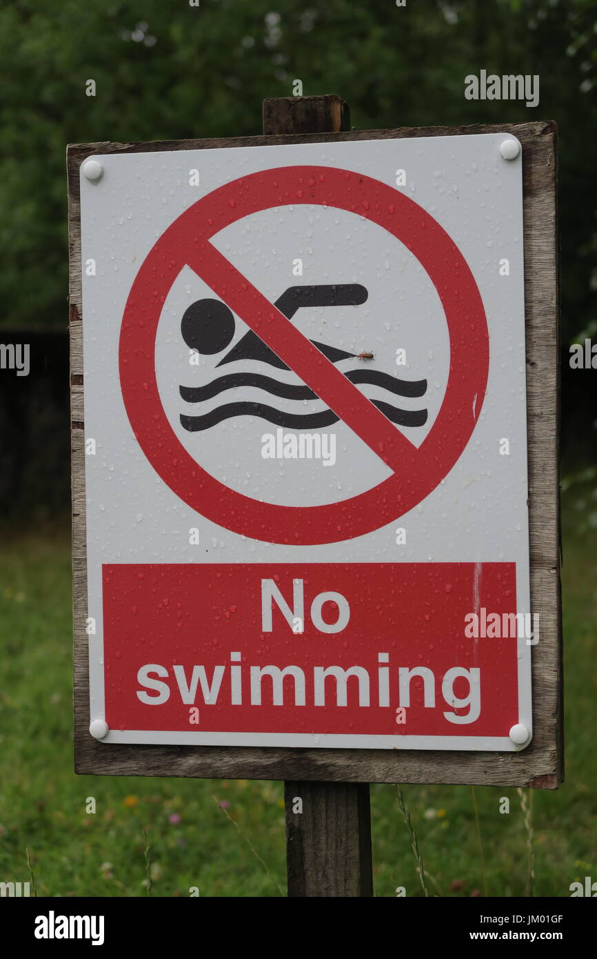 No swimming sign UK red and white Stock Photo