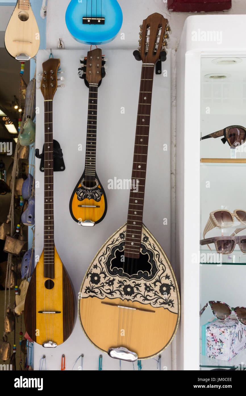 Mandolin musical instruments hanging outside shop in Mykonos, Greece Stock Photo