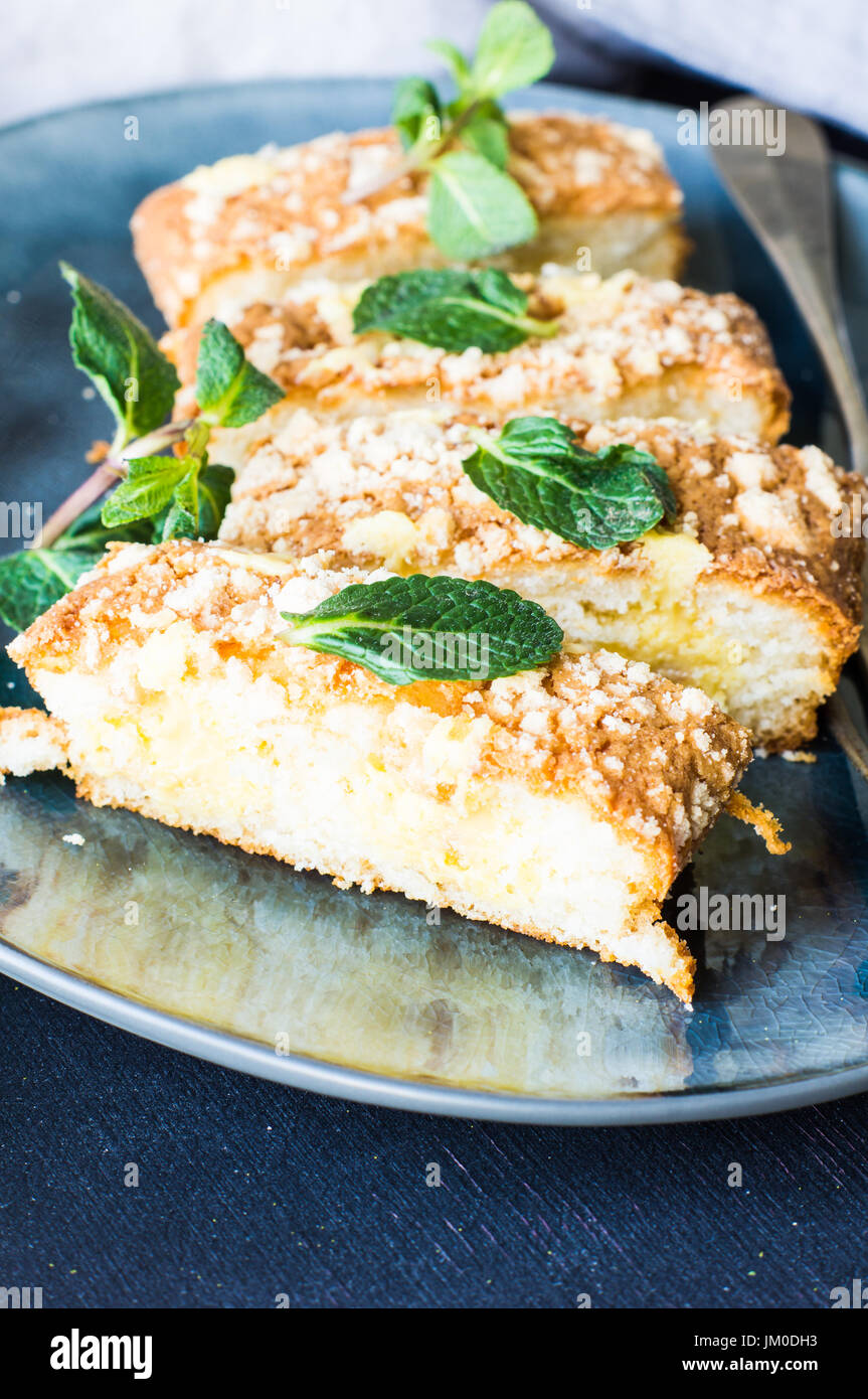 Traditional german vanilla kuchen cake with mint on a grey plate Stock ...