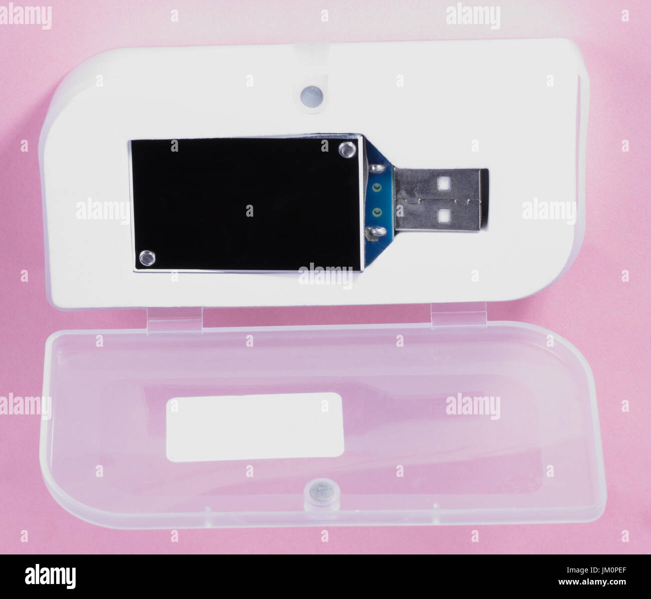 electronic device in plastic case on pink background at day Stock Photo ...