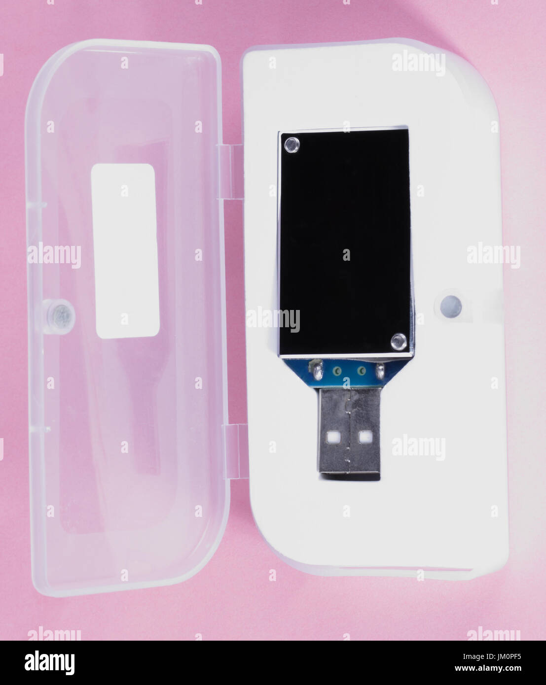 electronic device in plastic case on pink background at day Stock Photo ...