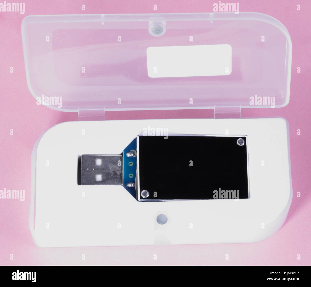 electronic device in plastic case on pink background at day Stock Photo ...