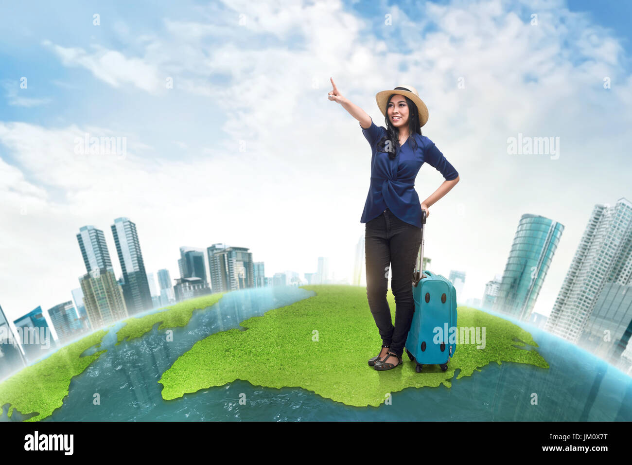 Happy asian woman tourist wearing hat looking something against futuristic background Stock Photo
