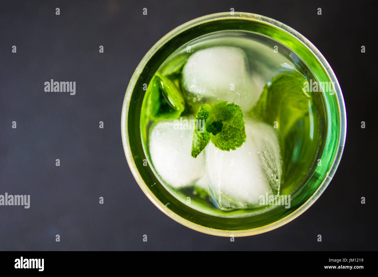 Summer drink glass of water with ice on dark background Stock Photo - Alamy