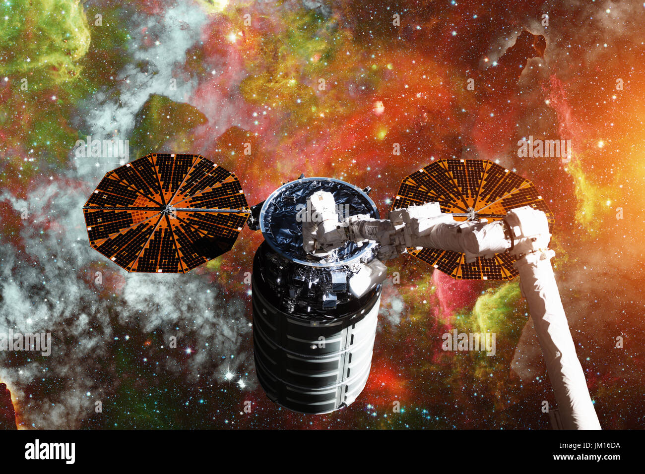 Cargo spacecraft - The Automated Transfer Vehicle over spiral galaxy. Elements of this image furnished by NASA. Stock Photo