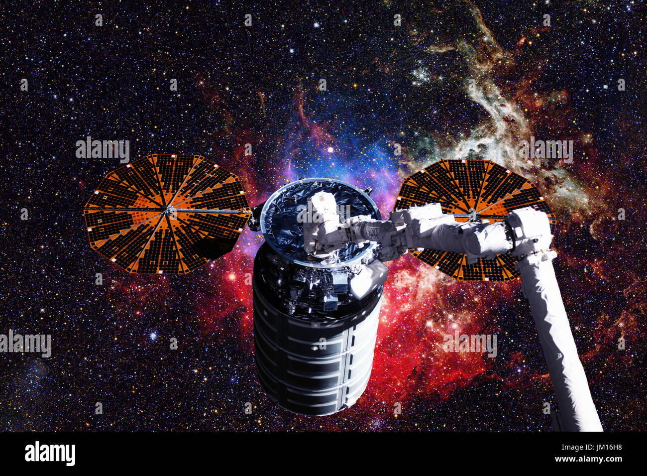 Cargo spacecraft - The Automated Transfer Vehicle over spiral galaxy. Elements of this image furnished by NASA. Stock Photo