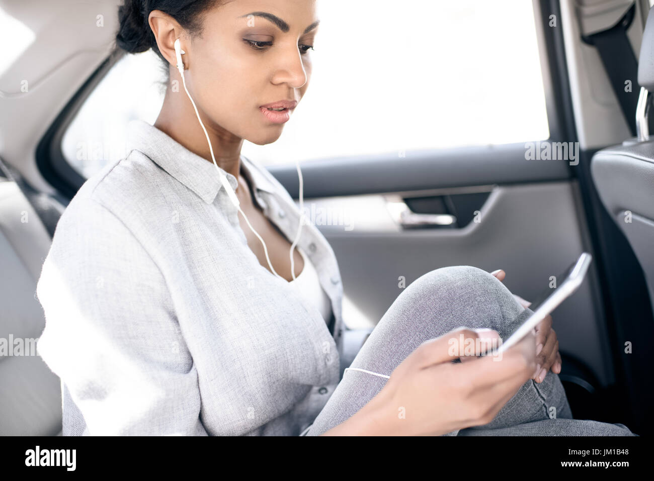 African woman sitting alone side view hi-res stock photography and ...