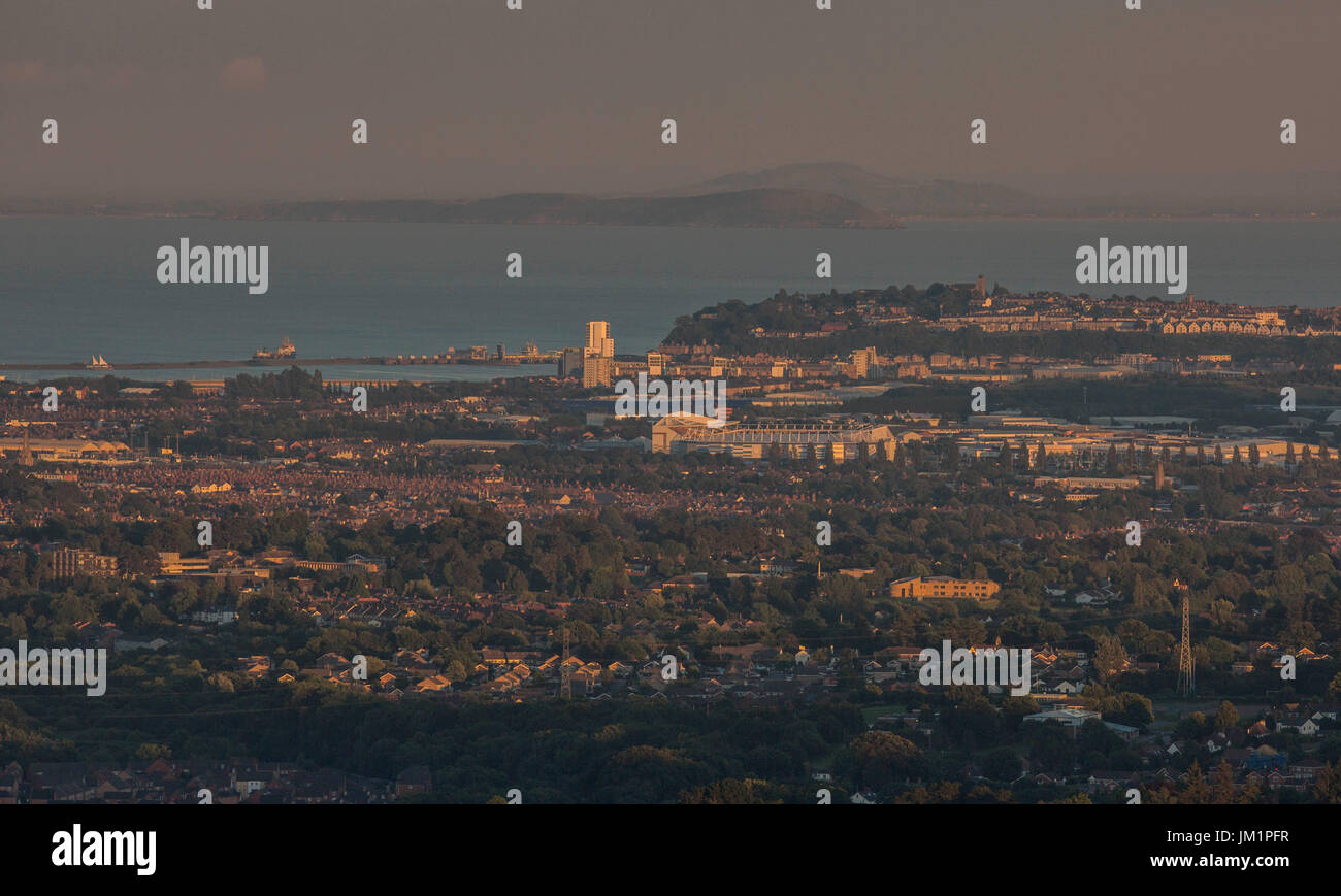 Overview of the city of Cardiff including Cardiff City Stadium and Penarth at sunset, with the Bristol Channel and Somersetshire in the background. Stock Photo