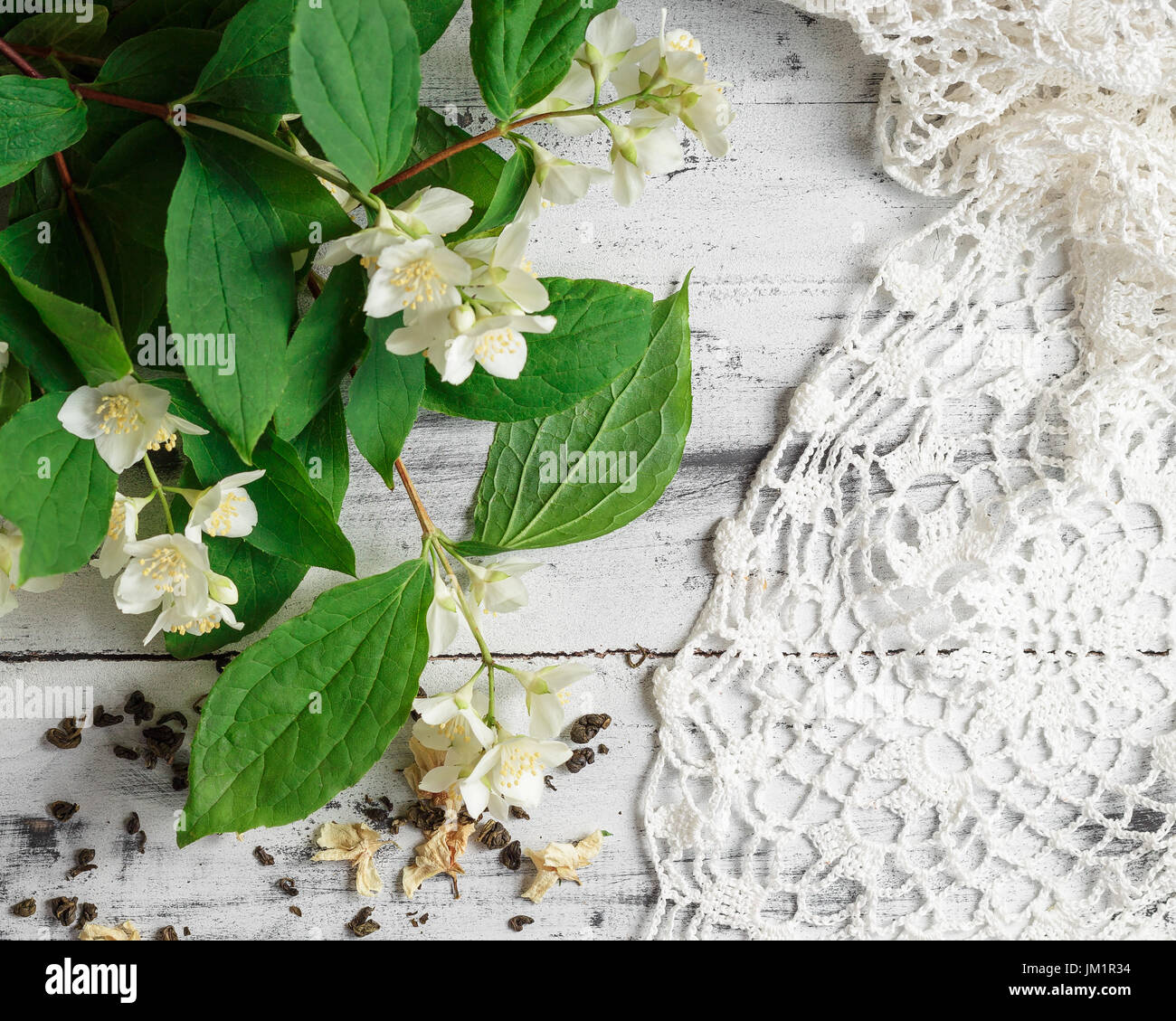 Scattered Dried Green Tea Leaves With Fresh Jasmine Flowers And Stock Photo Alamy