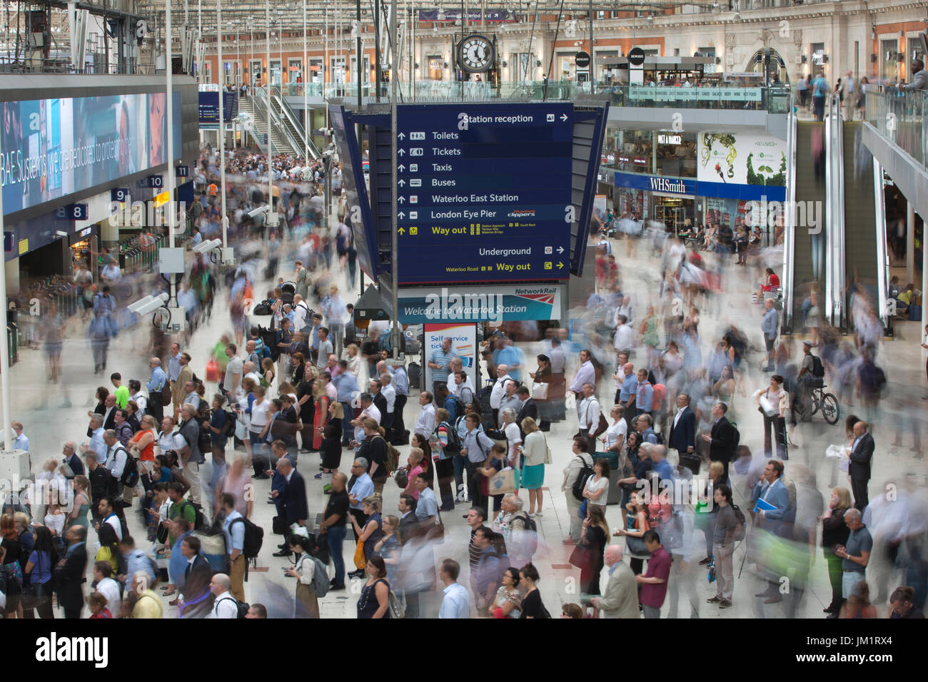 Rail commuters at Waterloo station, thousands of train passengers travel through Britain's busiest train station during rush hour, Central London, UK Stock Photo
