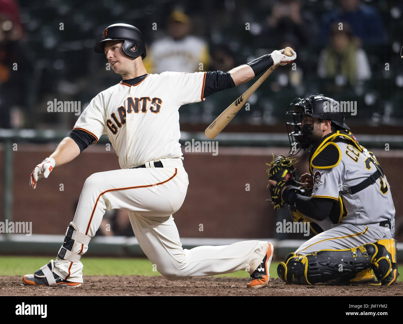 San Francisco, California, USA. 24th July, 2017. San Francisco Giants catcher Buster Posey (28) swings for strike two, with two outs in the bottom of the ninth inning, during a MLB game between the Pittsburgh Pirates and the San Francisco Giants at AT&T Park in San Francisco, California. The Pirates won 10-3. Valerie Shoaps/CSM/Alamy Live News Stock Photo