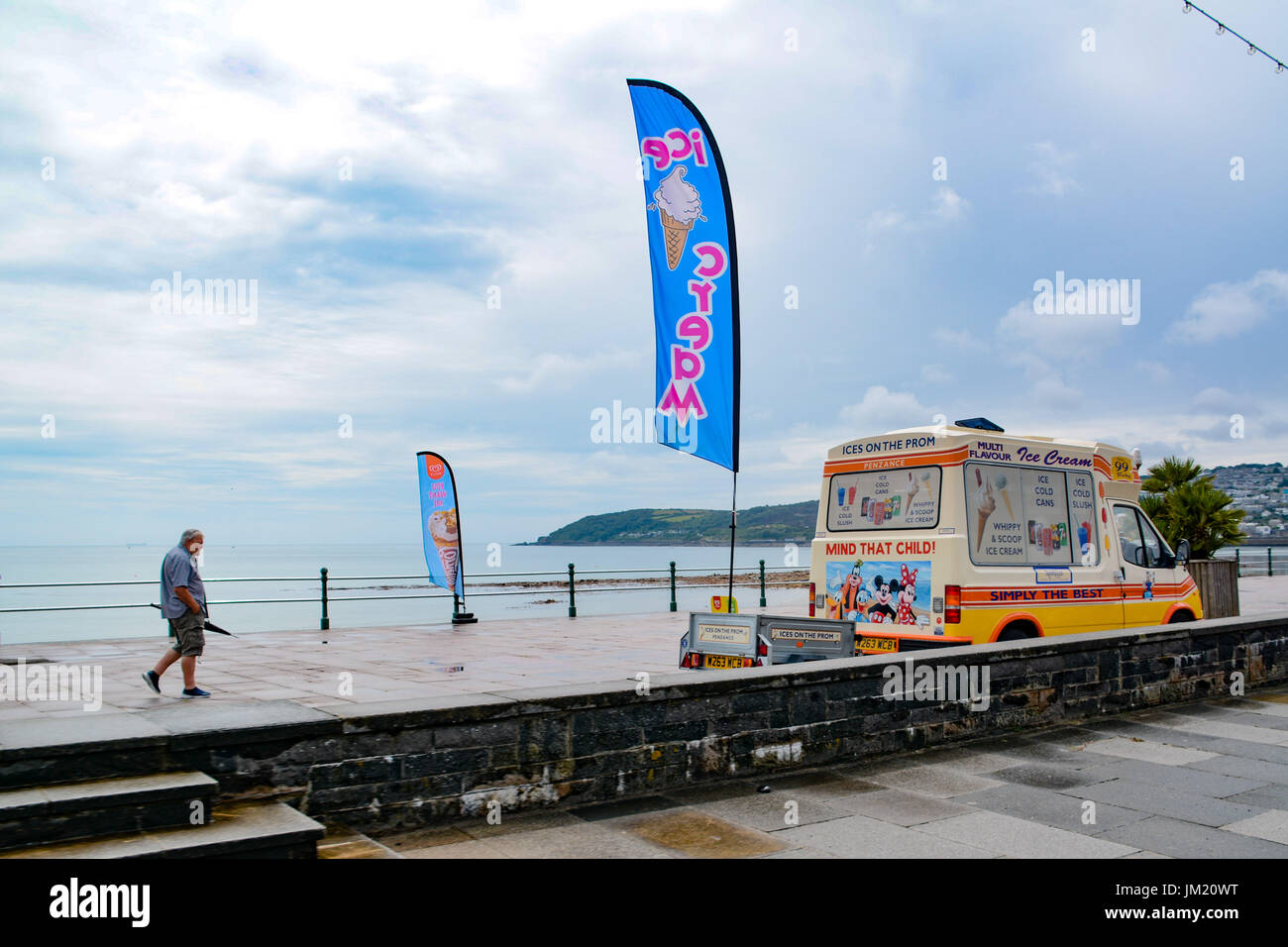 Penzance, Cornwall, UK. 25th July 2017. UK Weather. After a hot monday, the showers returned to Cornwall today - even though it was still warm. The outdoor lido pool was quiet for a summers day, as was the ice cream van on the sea front. Credit: cwallpix/Alamy Live News Stock Photo