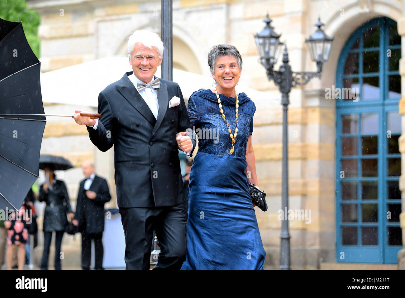 Bayreuth, Germany. 25th July, 2017. The mayor of Bayreuth, Brigitte Merk-Erbe (R) and her husband Thomas Erbe arrive for the opening of the festival in Bayreuth, Germany, 25 July 2017. The Richard Wagner Festival will be opened with the opera "The Master-Singers of Nuremberg". Photo: Tobias Hase/dpa/Alamy Live News Stock Photo