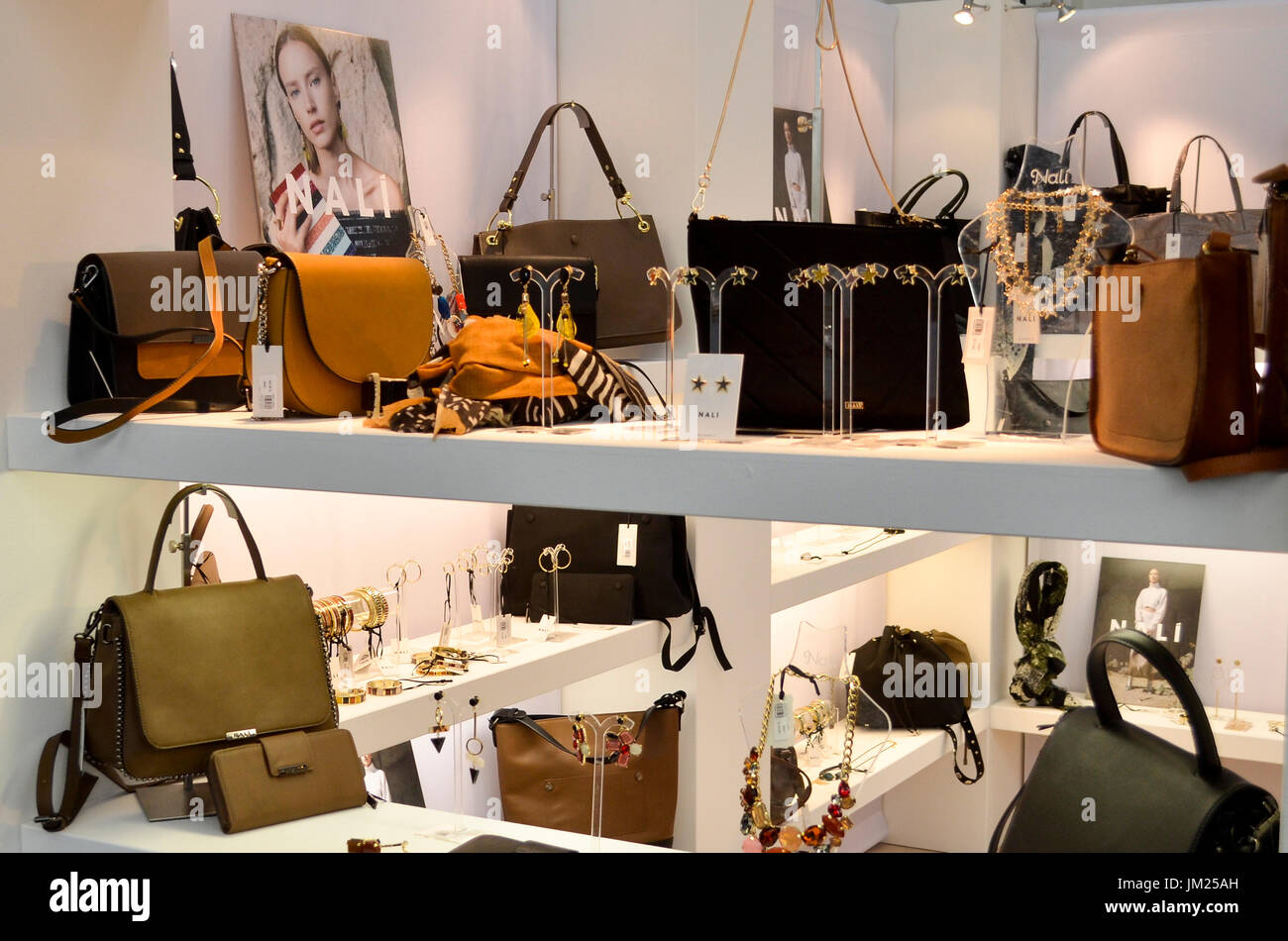 Handbags and jewellery on display at Pure London, Olympia, London, UK. Pure London, the UK's leading trade fashion exhibition opened its doors 23-25th July 2017, featuring two halls of trade stands from leading fashion and accessories designers, lectures from industry experts, and fashion shows on two different catwalks throughout each day. Fashion buyers were out in force to see the new season's collections. 25th July 2017. Credit: Antony Nettle/Alamy Live News Stock Photo