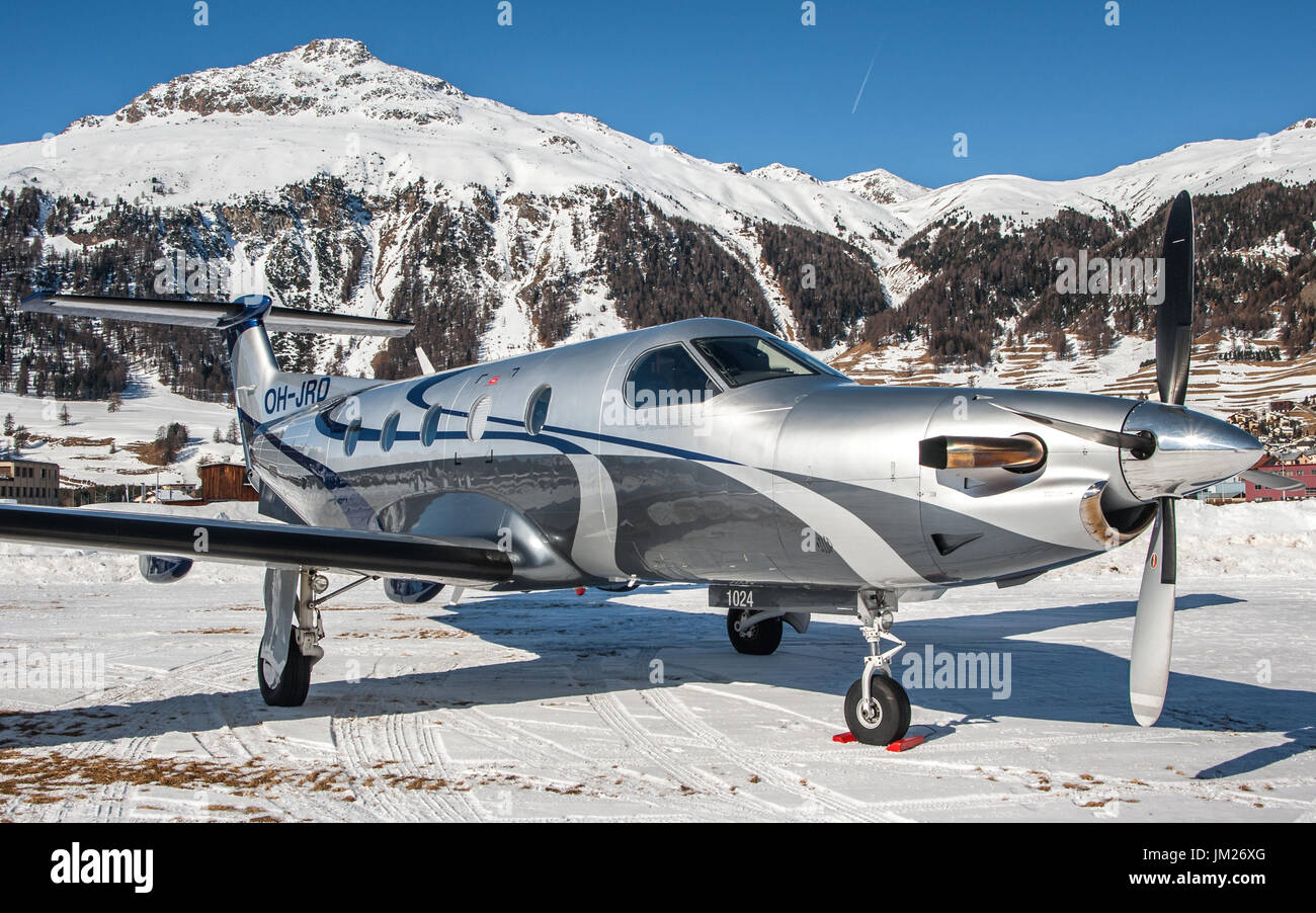 Parked over snow this Pilatus PC12. Samedan Engadin Airport, Switzerland Stock Photo