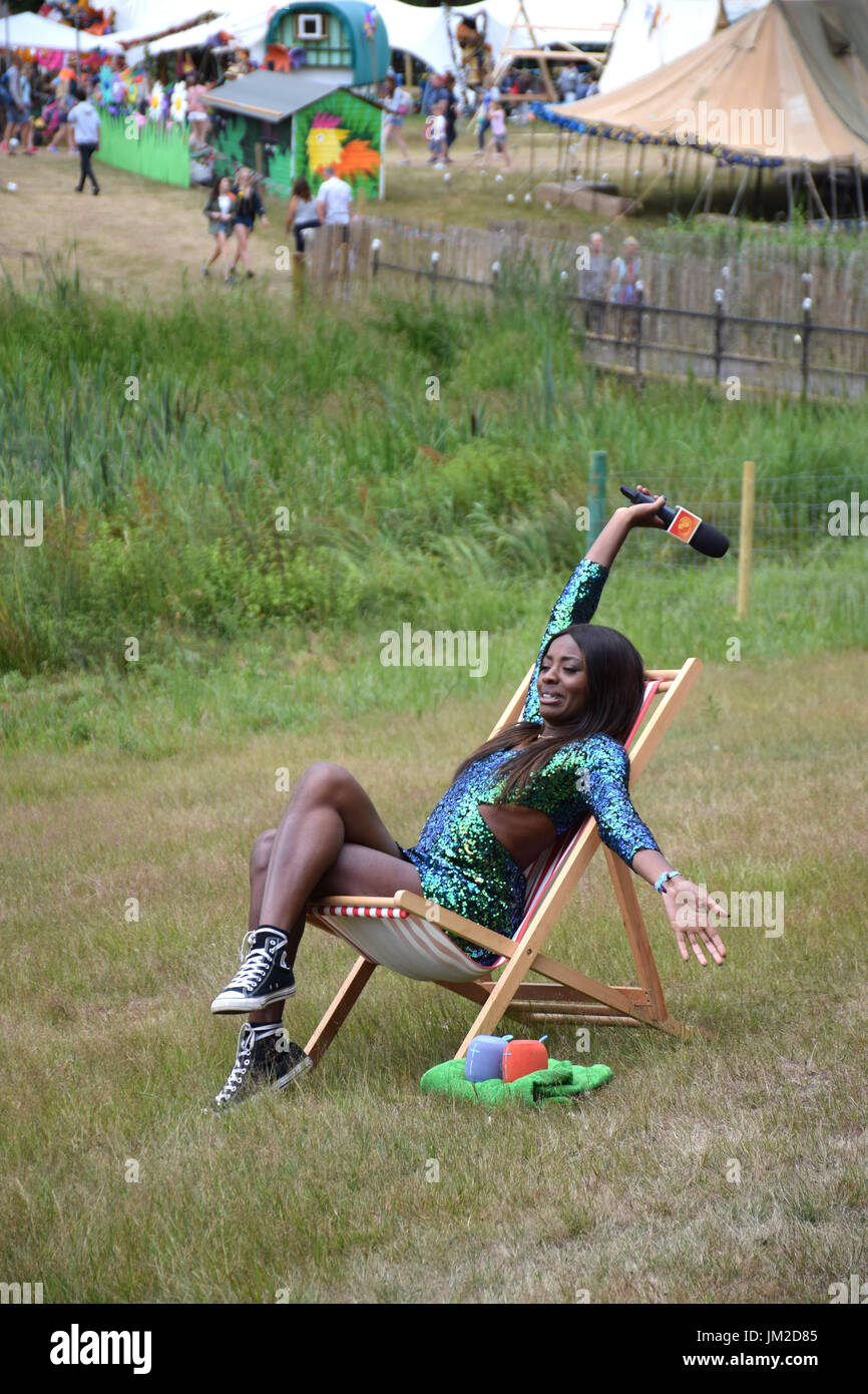 Latitude Festival 2017, Henham Park, Suffolk, UK. TV presenter AJ Odudu doing a piece to camera for E4 Stock Photo