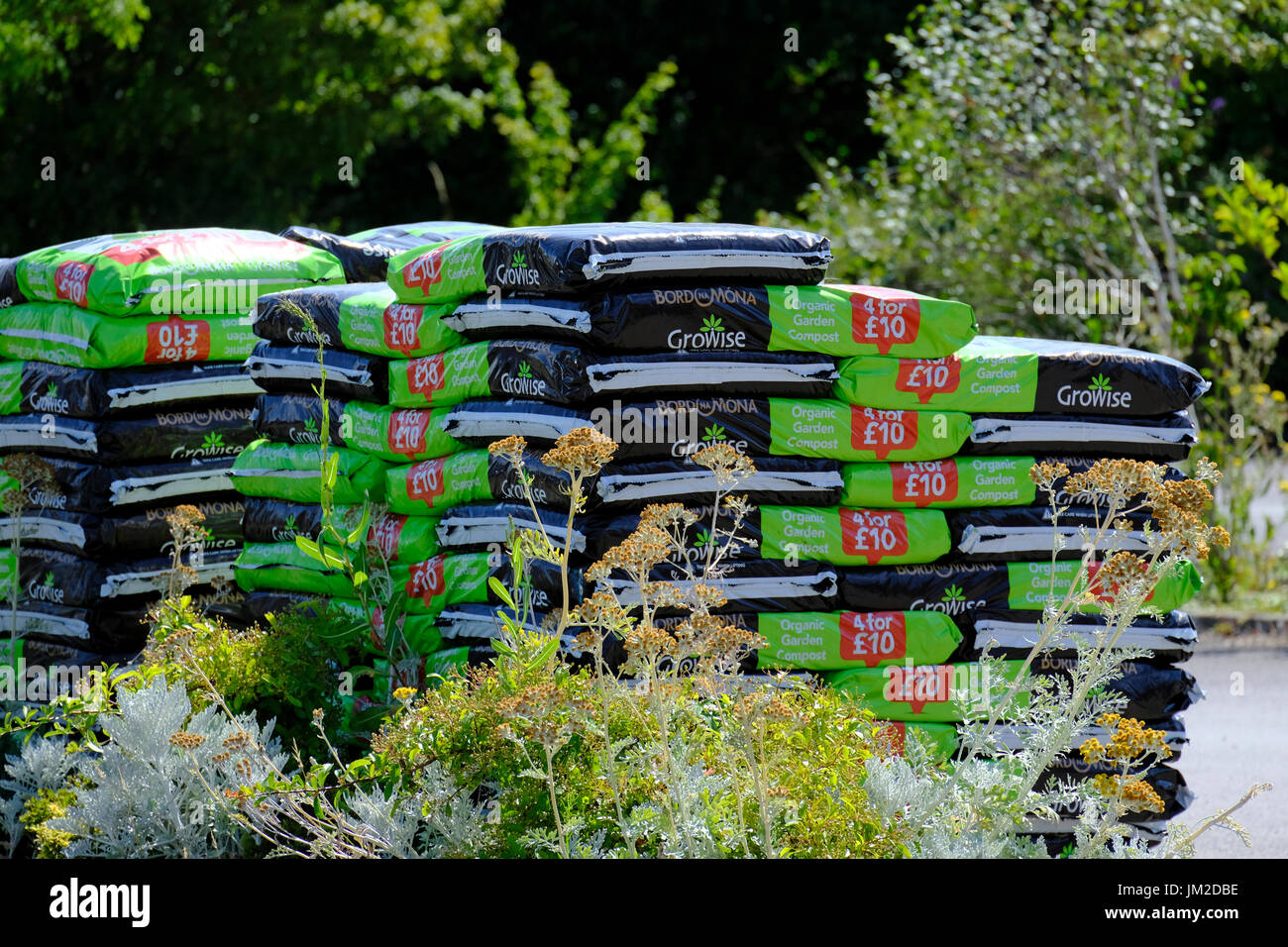 Stack of growbags for sale outside farm shop in West Sussex,UK Stock Photo