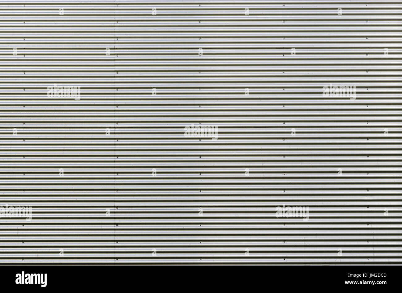 Corrugated metal sheet. Silver gray background pattern. Stock Photo