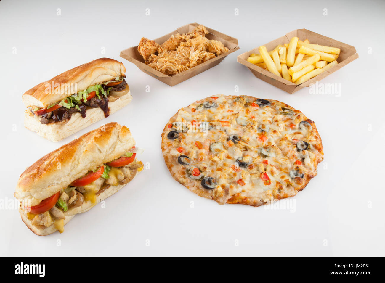 Fiesta sandiwches pizza chicken strips and fries Stock Photo Alamy