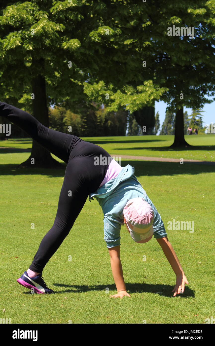 A young girl do some exercise in the park Stock Photo