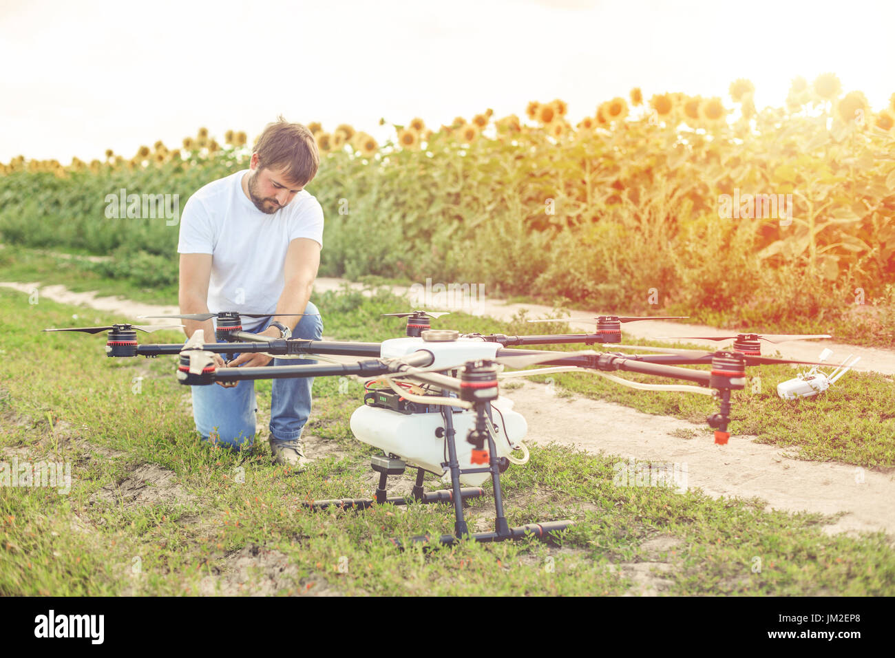 Young engineer preparing agriculture drone before flying Stock Photo ...