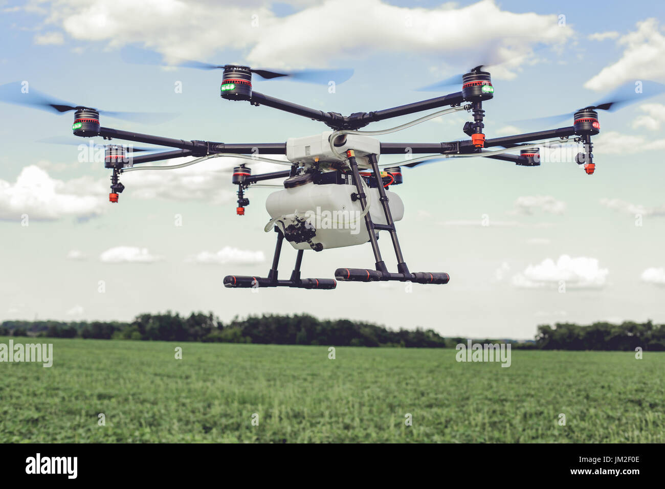 Professional agriculture drone flying and green wheat field Stock Photo ...